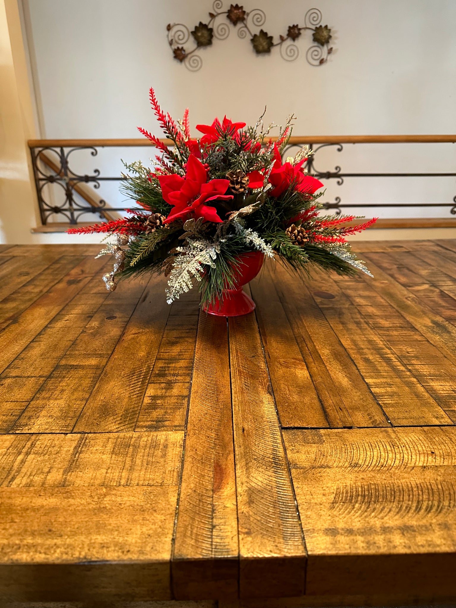 Red Pinsettias and Gold Berries Arrangement