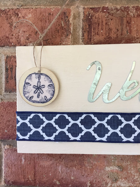 Welcome Sign with a Sand Dollar